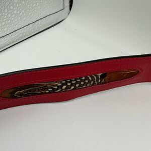Red Rondina leather belt with feather inlays